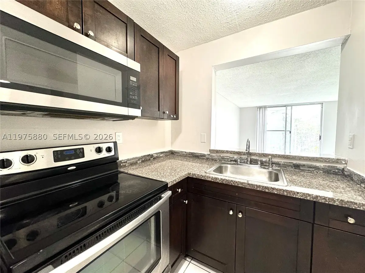 484 NW 165th St #A-411, Miami, FL 33169 - #1