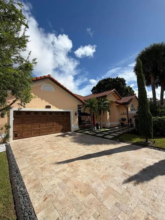 9050 Cypress Hollow Drive, Palm Beach Gardens, FL 33418