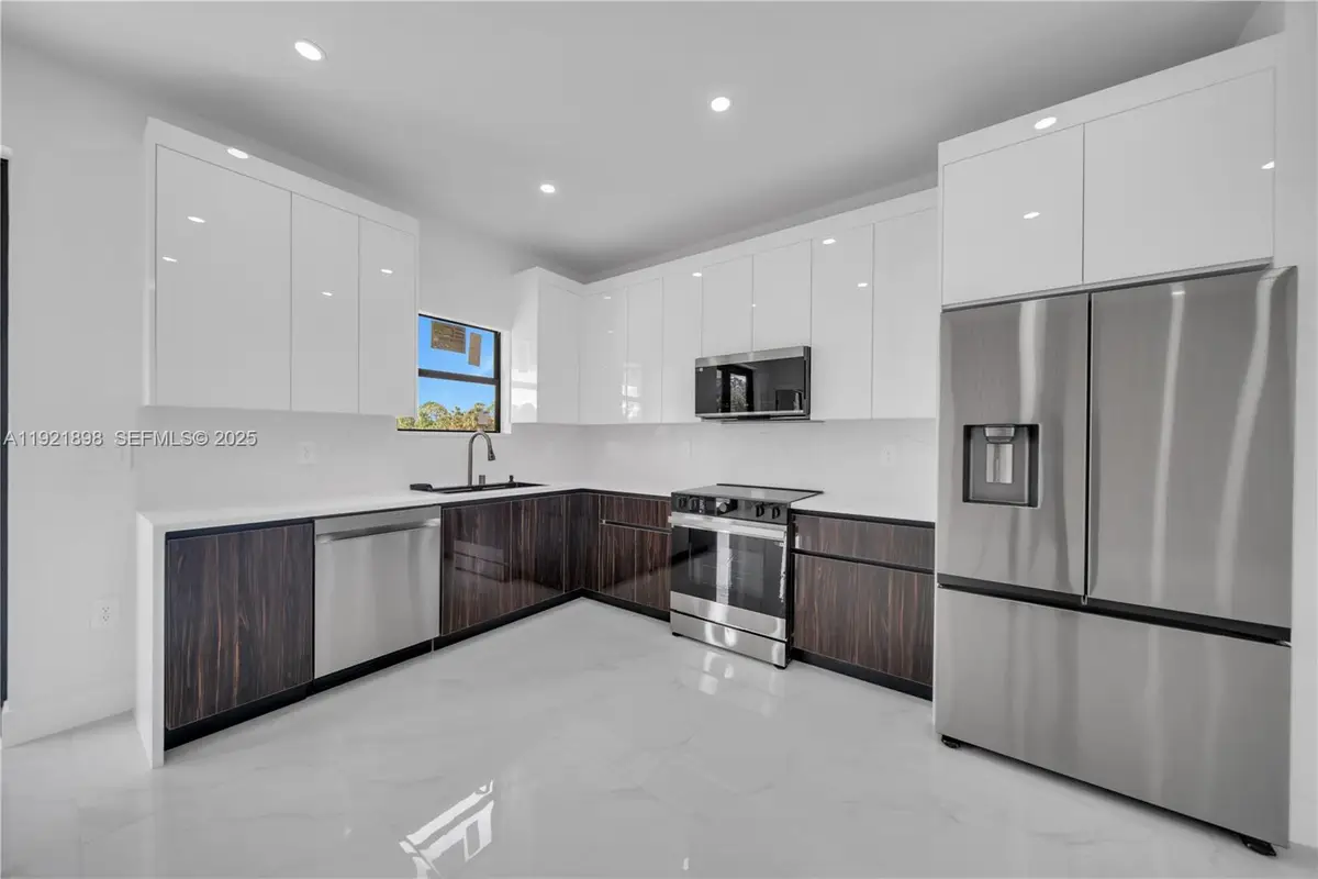 704 Holmes Ave, Lehigh Acres, FL 33974 - #1